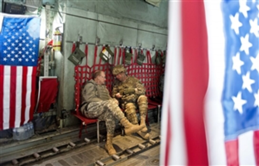 U.S. Army Gen. Martin E. Dempsey, left, chairman of the Joint Chiefs of Staff, arrives on Forward Operating Base Sharana in Paktika province, Afghanistan, April 7, 2013. 