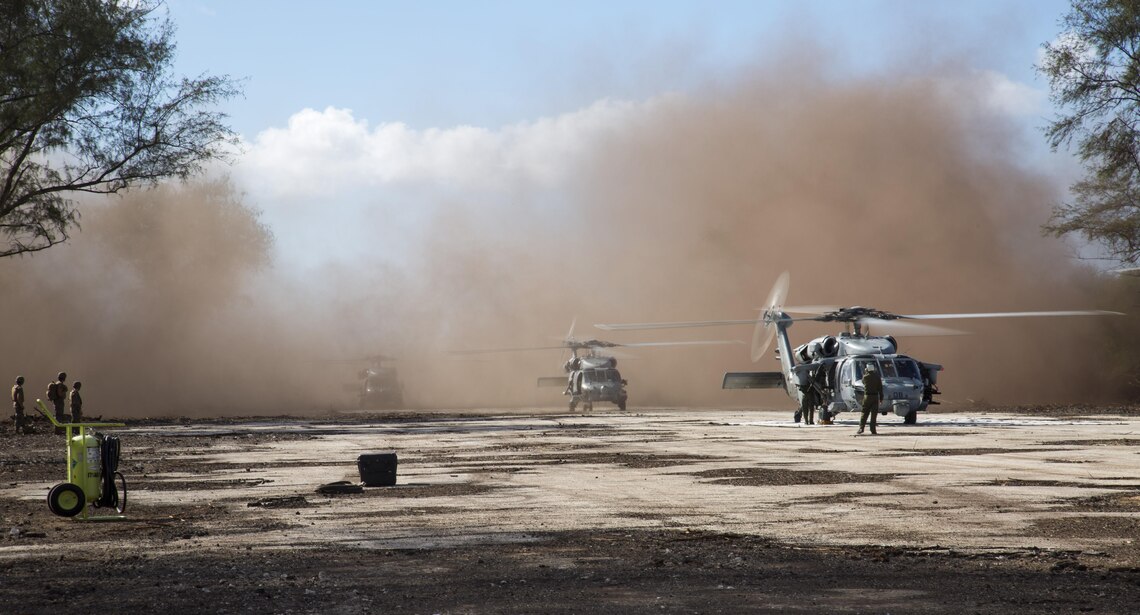 A Navy MH-60 Seahawk helicopter lands Dec. 9 at Charlie runway on Tinian’s North Field during Exercise Forager Fury II to execute a forward arming and refueling point training. The exercise encompasses fixed and rotary-wing flight operations allowing exploitation of several Marine aviation functions including assault support and fuel storage and distribution. FF II allows Marines and sailors to join forces to expand aviation capabilities. The MH-60 is with Helicopter Sea Combat Squadron 25, stationed at Andersen Air Force Base, Guam. 