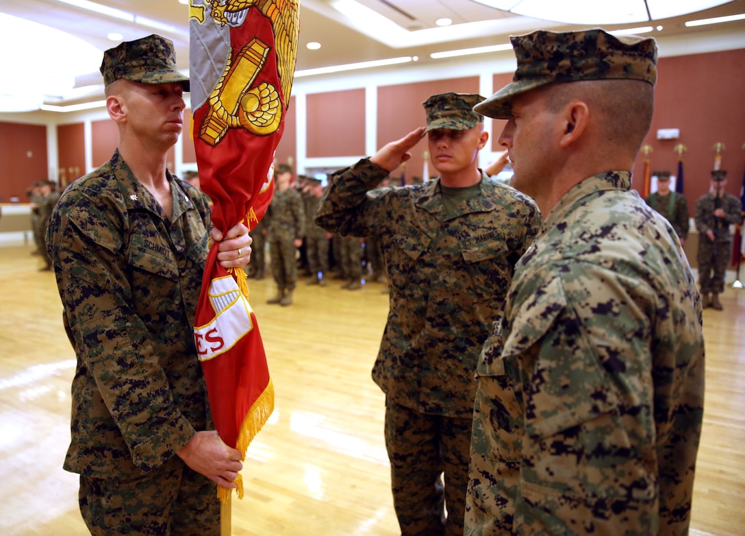 Lieutenant Col. Joel F. Schmidt receives the unit’s colors from Lt. Col. Steven M. Wolf, as Schmidt assumes control of 2nd Battalion, 2nd Marine Regiment, 2nd Marine Division aboard Marine Corps Base Camp Lejeune, Dec. 10, 2013. Wolf is departing 2nd Bn., 2nd Marines and will attend the College of Naval Warfare in Newport, R.I., and Schmidt is coming from Marine Corps Forces Special Operations Command.