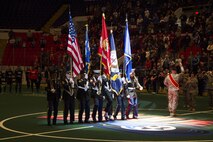 Sgts. Deon Craft and Nathan Krohn, Marines with Recruiting Station Milwaukee, march on the colors alongside the Army, Navy and Air Force, during the Milwaukee Wave opening home game Dec. 7, 2013. The Milwaukee wave designated the home opener as a “Military Appreciation Game,” taking a moment of silence for those lost at Pearl Harbor on Dec. 7, 1941.