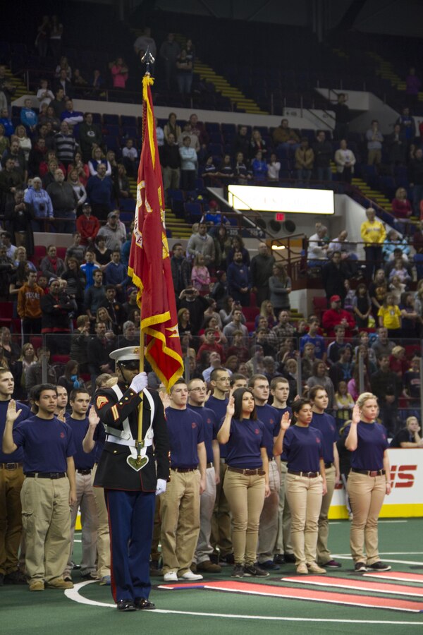 Nearly 40 poolees from Recruiting Station Milwaukee took the oath of enlistment alongside their fellow future servicemembers during the Milwaukee Wave opening home game Dec. 7, 2013. The Milwaukee wave designated the home opener as a “Military Appreciation Game,” taking a moment of silence for those lost at Pearl Harbor on Dec. 7, 1941.