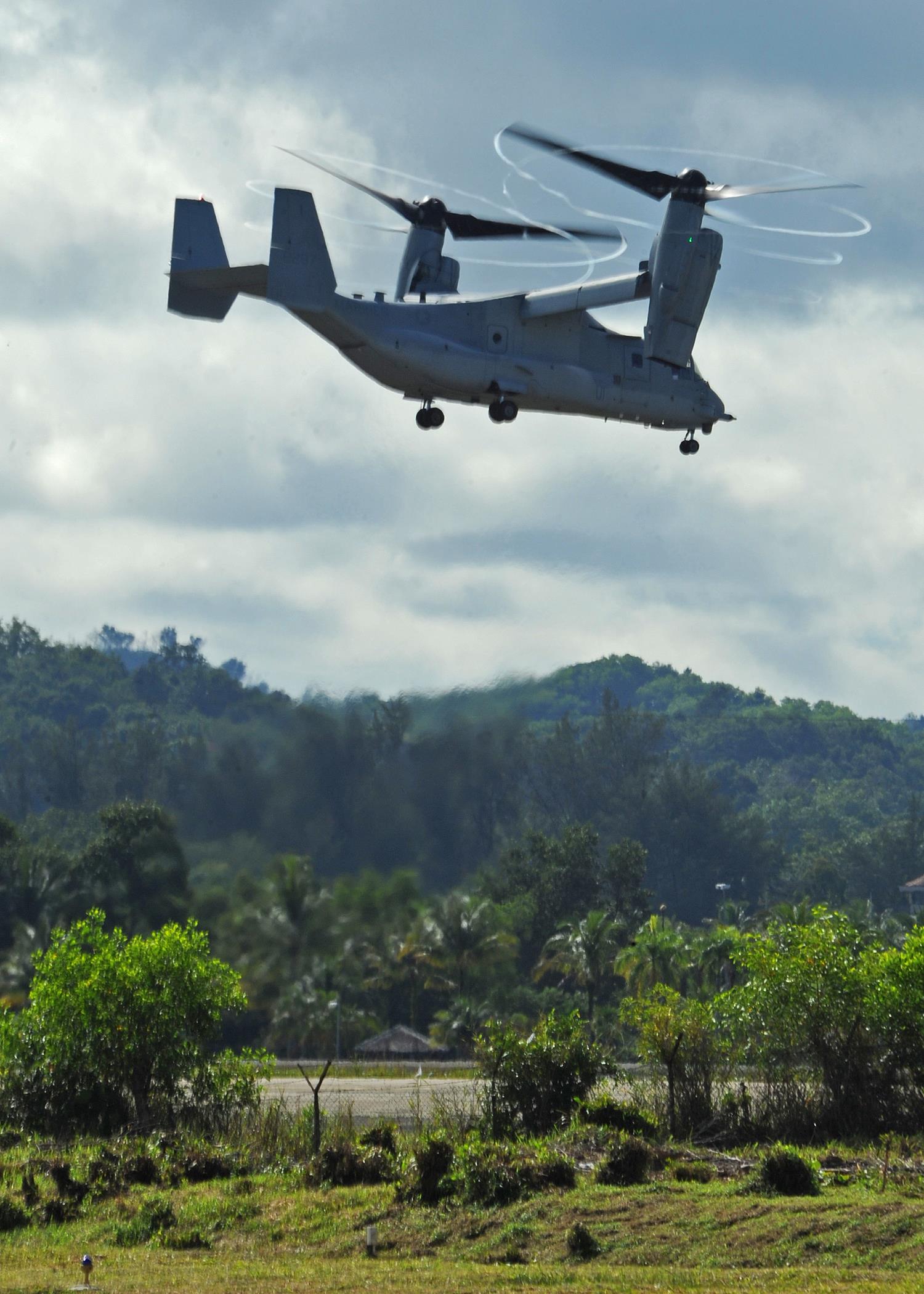 A U.S. Marine Corps MV-22B Osprey prepares to land after a flight at Rimba Air Base during the 4th biennial Brunei Darussalam International Defense Exhibition, Dec. 4, 2013. The MV-22 is the world’s first production tilt-rotor aircraft. This aircraft’s tilt-rotor technology is revolutionizing military assault support in a manner not seen since the introduction of helicopters more than 50 years ago. Unlike any aircraft before it, the MV-22 successfully blends the vertical flight capabilities of helicopters with the speed, range, altitude and endurance of fixed-wing transports. This unique combination provides an unprecedented advantage to warfighters, allowing current missions to be executed more effectively, and new missions to be accomplished. BRIDEX 13 is an opportunity for networking and sharing technology with regional partners and allies which builds strong multilateral relationships, increases cooperation and enhances preparedness for disasters and other contingency operations. Displays and demonstrations provide DOD and U.S. companies an opportunity to showcase U.S. defense capabilities across land, sea, air and security spectrums. (U.S. Air Force photo/Master Sgt. Jerome S. Tayborn)
