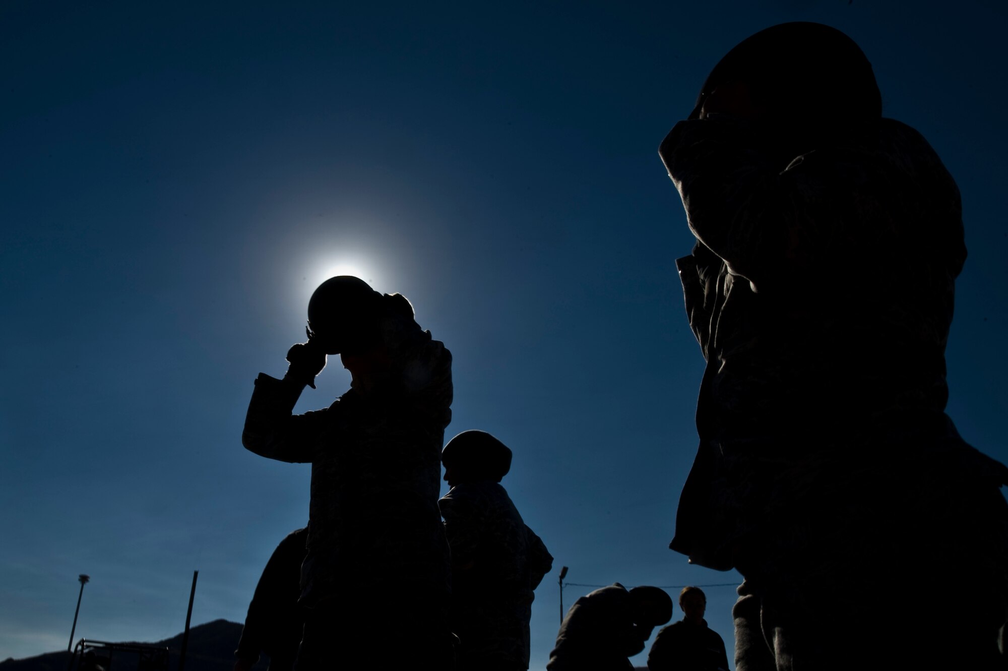 The only female 99th Security Forces Squadron team participating in the 99th SFS Warrior Challenge prepares for the ruck march Dec. 6, 2013, at Nellis Air Force Base, Nev. Each team was evaluated on their time on a half-mile ruck march. (U.S. Air Force photo by Airman 1st Class Christopher Tam)