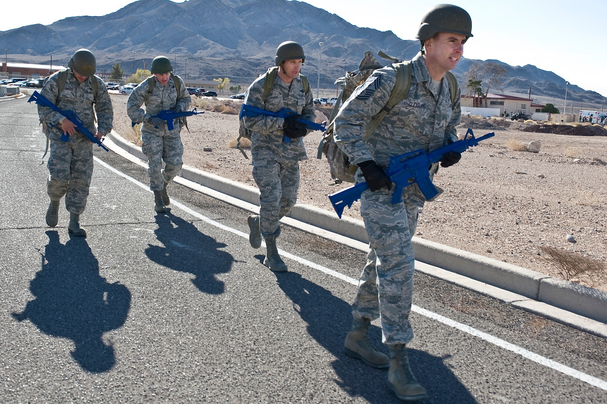 The 99th Air Base Wing leadership team does a half mile ruck march in area 2 during the 99th Security Forces Squadron Warrior Challenge Dec. 6, 2013, at Nellis Air Force Base, Nev. The challenge was designed to test teams' physical, mental and social capabilities. (U.S. Air Force photo by Senior Airman Matthew Lancaster)