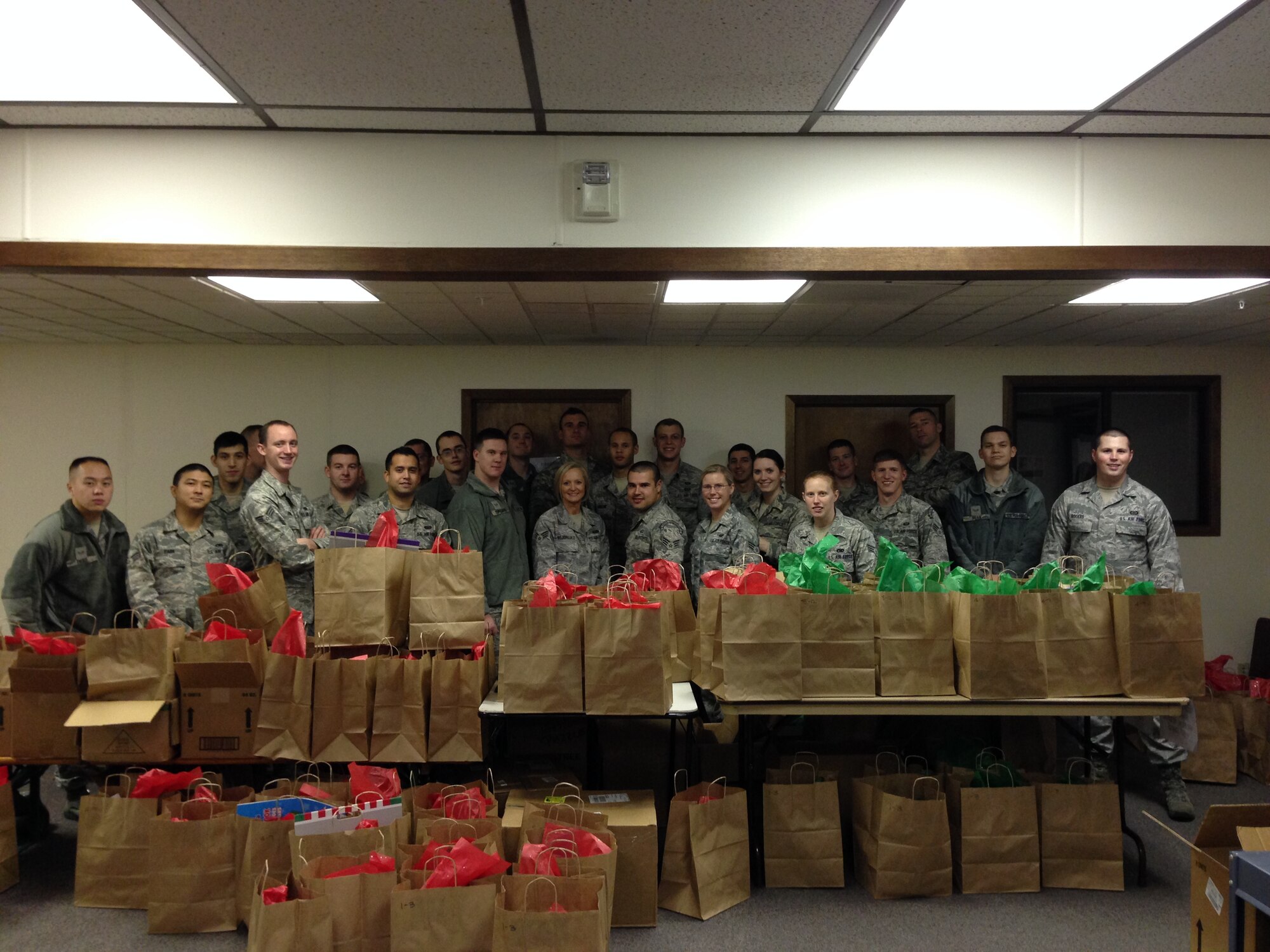 Fairchild Airman Leadership School students volunteer to sort toys for the Operation Homefront Toy Drive Nov. 19, 2013, at Fairchild Air Force Base, Wash. Operation Homefront provides emergency financial and other assistance to the families of our service members and wounded warriors. (U.S. Air Force photo by Suzette Hill/Released)