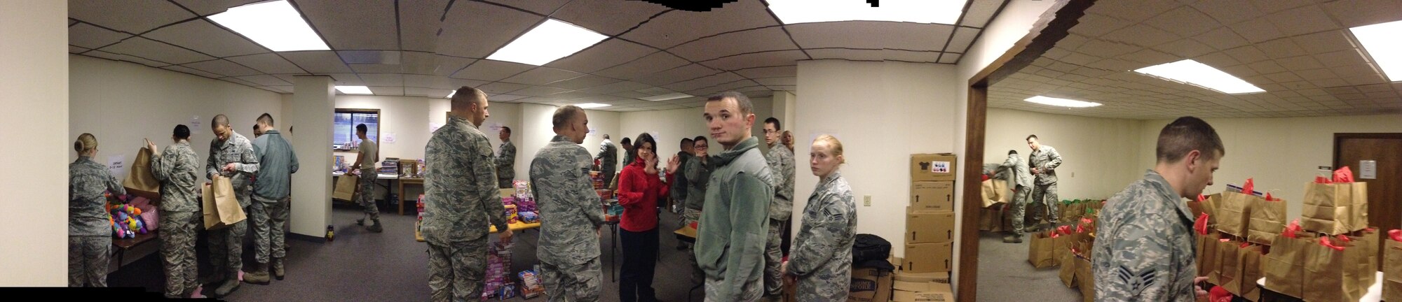 Fairchild Airman Leadership School students volunteer to sort toys for the Operation Homefront Toy Drive Nov. 19, 2013, at Fairchild Air Force Base, Wash. Operation Homefront provides emergency financial and other assistance to the families of the service members and wounded warriors. (U.S. Air Force photo by Suzette Hill/Released)