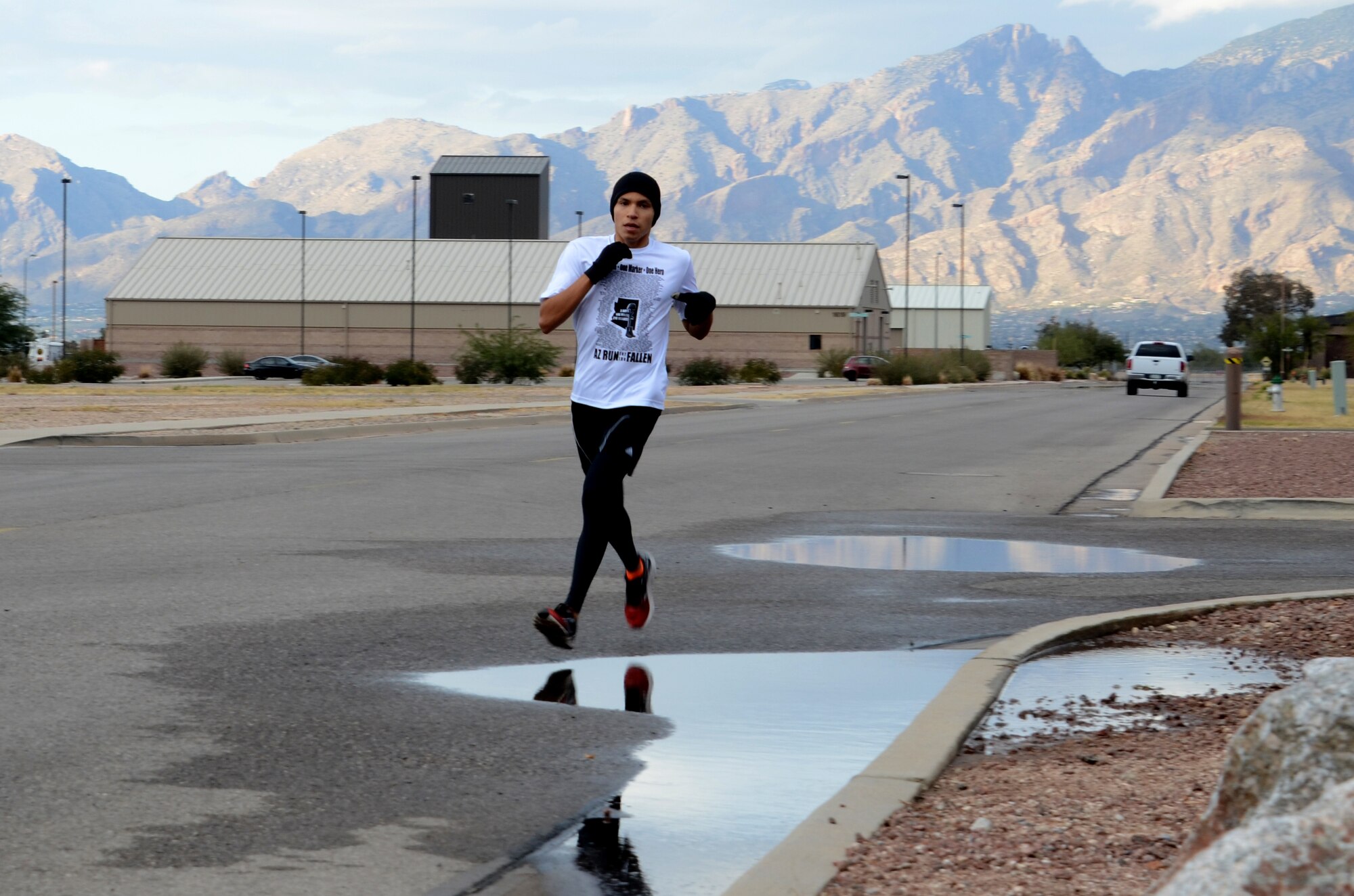 Senior Airman Savas Rivera, a regional weather forecaster/special support forecaster assigned to the 612th Support Squadron, runs around Davis-Monthan AFB, Ariz., as part of his marathon training, Dec. 5, 2013.  Rivera trained for the Holualoa Tucson Marathon and set a new personal record on Oct. 8.  (U.S. Air Force photo by Staff Sgt. Heather R. Redman/Released)   