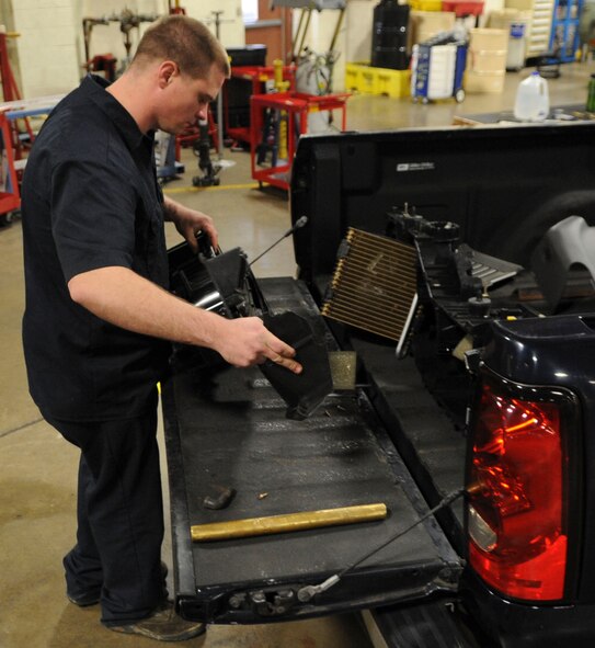 Staff Sgt. Cody Steward, 2nd Logistics Readiness Squadron vehicle maintenance technician, looks over a heating, ventilation, and air conditioning module for defects on Barksdale Air Force Base, La., Dec. 10, 2013. The vehicle maintenance Airmen are trained to repair more than 20 different types of vehicles including fire trucks, refueling trucks, every day-use vehicles, ambulances, buses and maintenance trucks used to tow aerospace ground equipment. (U.S. Air Force photo/Senior Airman Kristin High)
