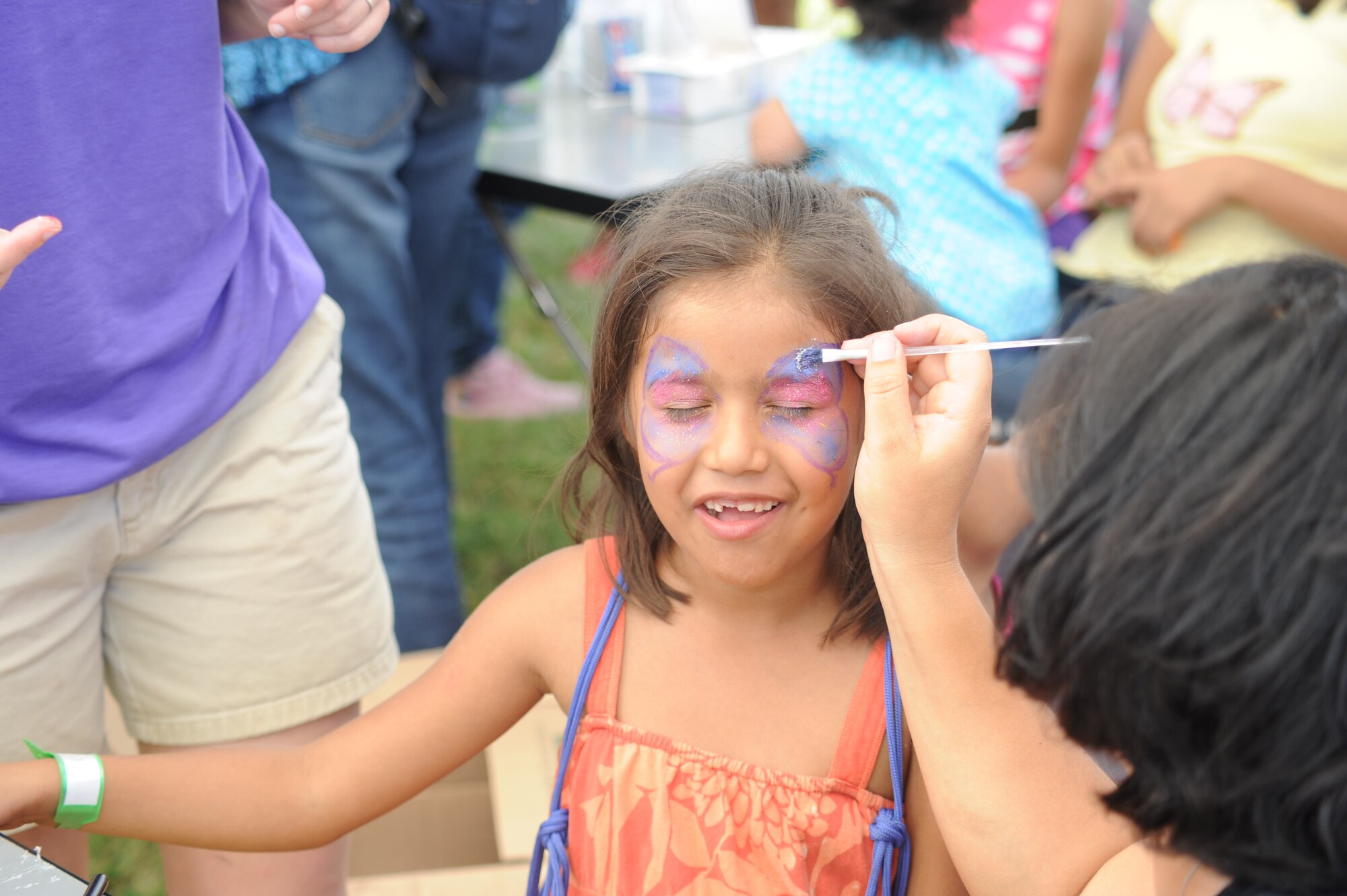 A young girl gets her face painted during Joint Task Force-Bravo's "Operation Holiday Blessing," at Soto Cano Air Base, Honduras, Dec. 6, 2013. More than 300 Honduran orphans were treated to a day of activities, gifts, and holiday joy, provided by more than 200 volunteers from the Task Force. (Photo by Martin Chahin)
