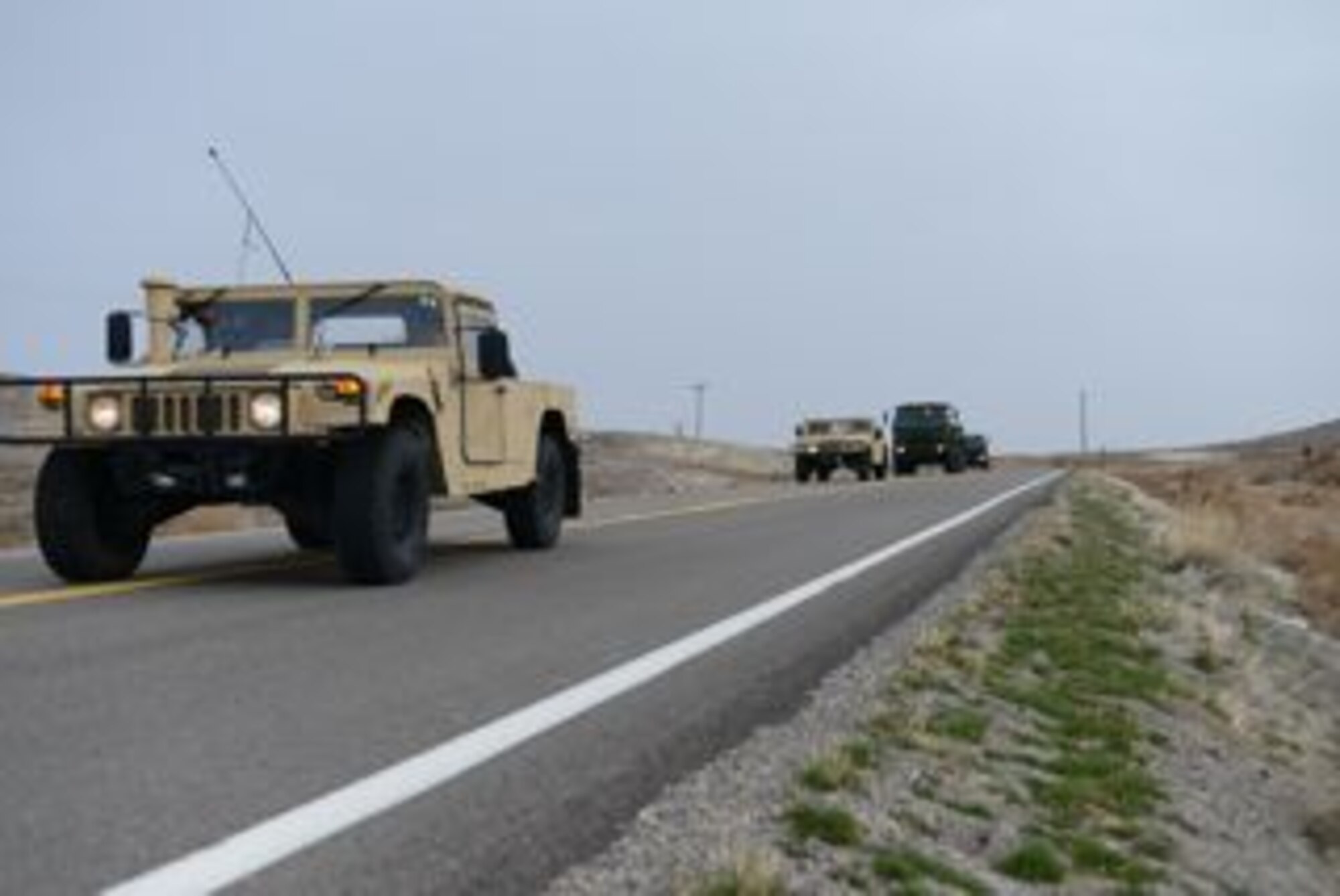 U.S. Air Force Airmen from the 366th Logistics Readiness Saquadron perform convoy maneuvers Dec. 6, 2013, near Mountain Home Air Force BAse, Idaho. The Convoy Operations Readiness Training is designed to teach Airmen about multiple skills including radio communications, vehicle camouflage, and conbat convoy operations. (U.S. Air Force photo by Senior Airman Benjamin Sutton/Released)