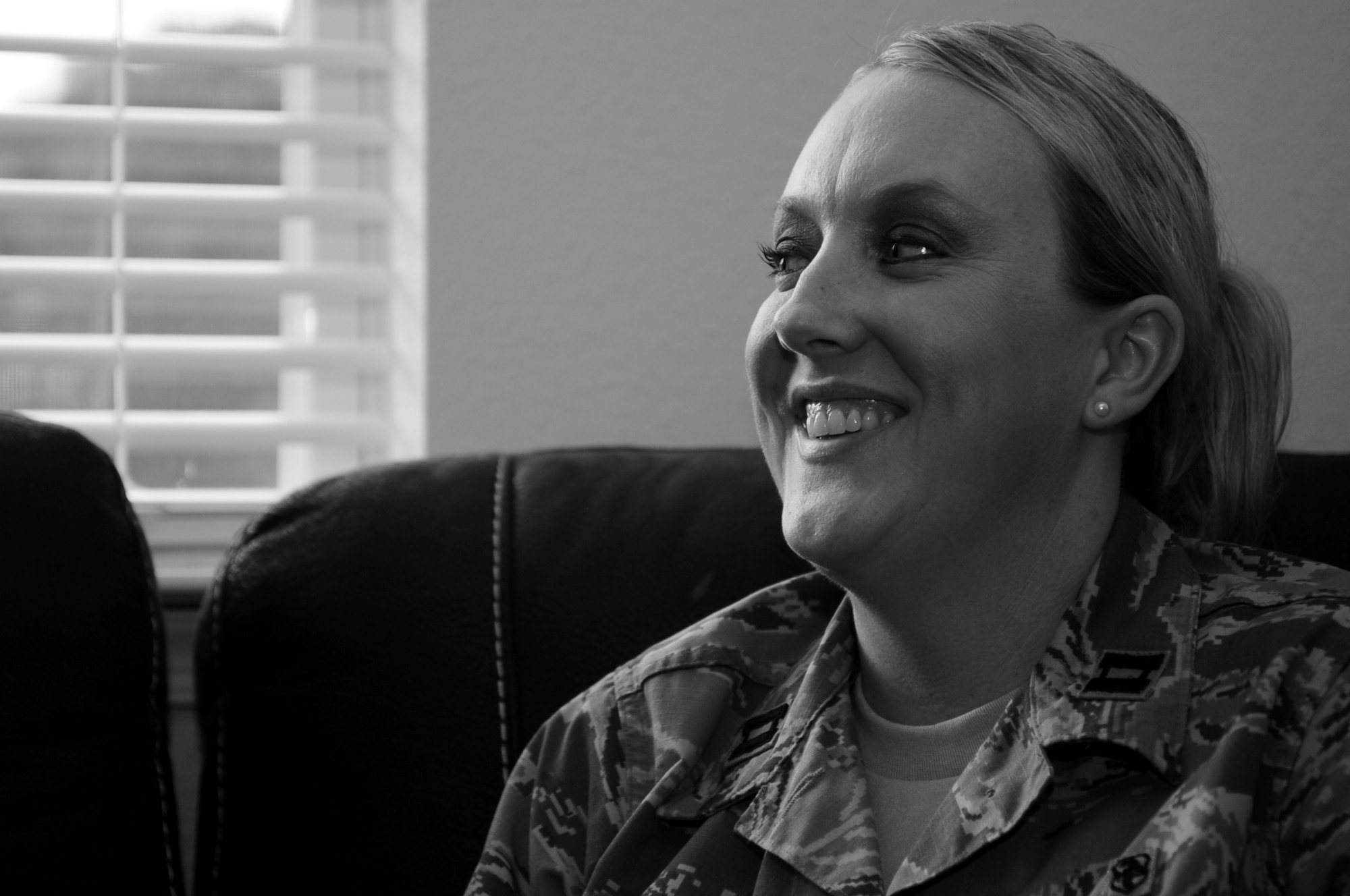 U.S. Air Force Capt. Candace Lucas, Air Combat Command Commander’s Action Group strategic communication lead, laughs during a conversation with her husband, Chief Master Sgt. James Lucas, 633rd Mission Support Group Superintendent, at Langley Air Force Base, Va., Dec. 6, 2013. During her time with the Air Force, Candace has experienced life as an enlisted Airman, military spouse and commissioned officer. (U.S. Air Force photo by Staff Sgt. Jarad A. Denton/Released)