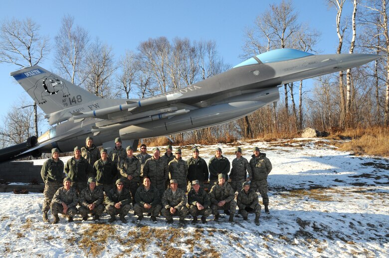 U.S. Air Force F-16 Crew Chiefs, 148th Fighter Wing, Duluth, Minn. pose for a group photo on Dec. 4, 2011.  The crew chiefs have been helping to raise money annually since 2010 in hopes of giving some local children a better Christmas.  (U.S. Air National Guard photo by Tech. Sgt. Brett R. Ewald/Released)
