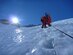 The sun shows its face to the climbers on the ice of the Lhotse Face as they make the final, grueling steps into Camp 3 at 24,000 feet May 20, 2013. One Sherpa had died there just days before. (photo by Nick Gibson)  