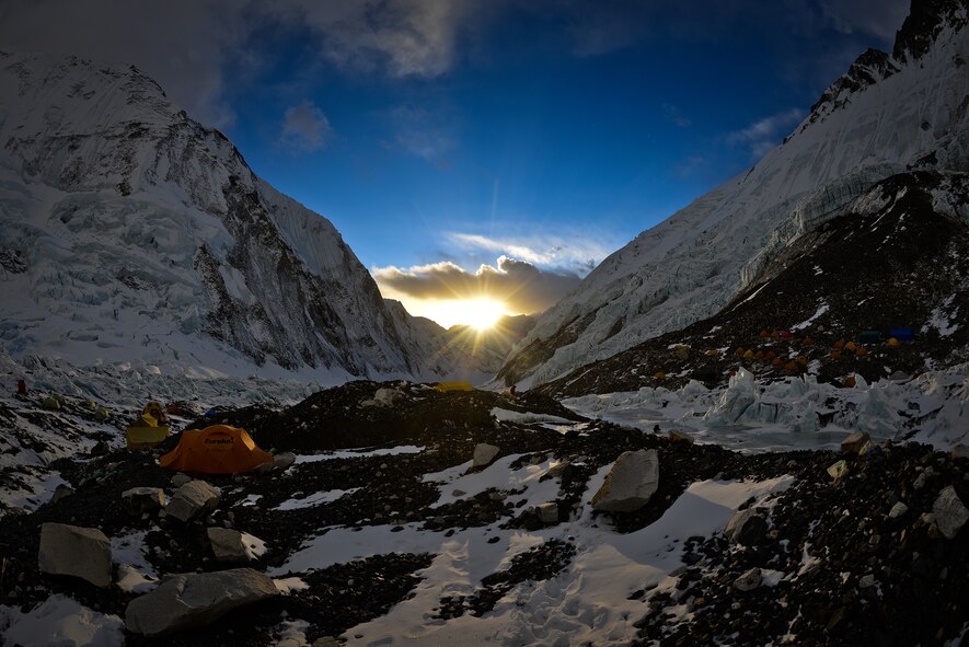 The sun breaks over the West Shoulder of Mt. Everest, thawing the hundreds of frozen tents in Basecamp April 28, 2013. Many hikers are not at the camp to see this sight, as most depart well before sunrise to make it to Camp 1 before sunset. (photo by Nick Gibson)  