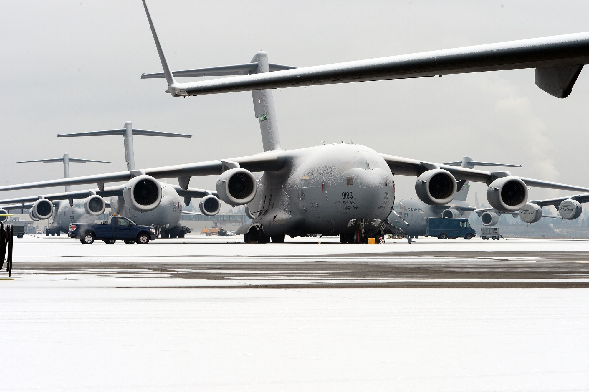 A C-17 Globemaster III aircraft is parked on the McChord Field ramp, Dec. 10, 2013 at Joint Base Lewis-McChord, Wash. Earlier in the morning, McChord Field experienced its first snow fall of the season. (U.S. Air Force photo/Airman 1st Class Jacob Jimenez) 