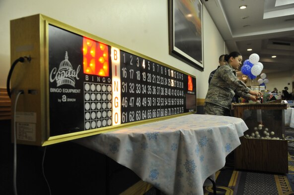 U.S. Air Force Airman 1st Class Cynthia Davis, 509th Force Support Squadron apprentice, hosts the bingo contest at Whiteman Air Force Base, Mo., Dec. 3, 2013. The bingo contest was held at the Mission’s End as part of the festivities after the base tree-lighting ceremony. (U.S. Air Force photo by Airman 1st Class Keenan Berry/Released)