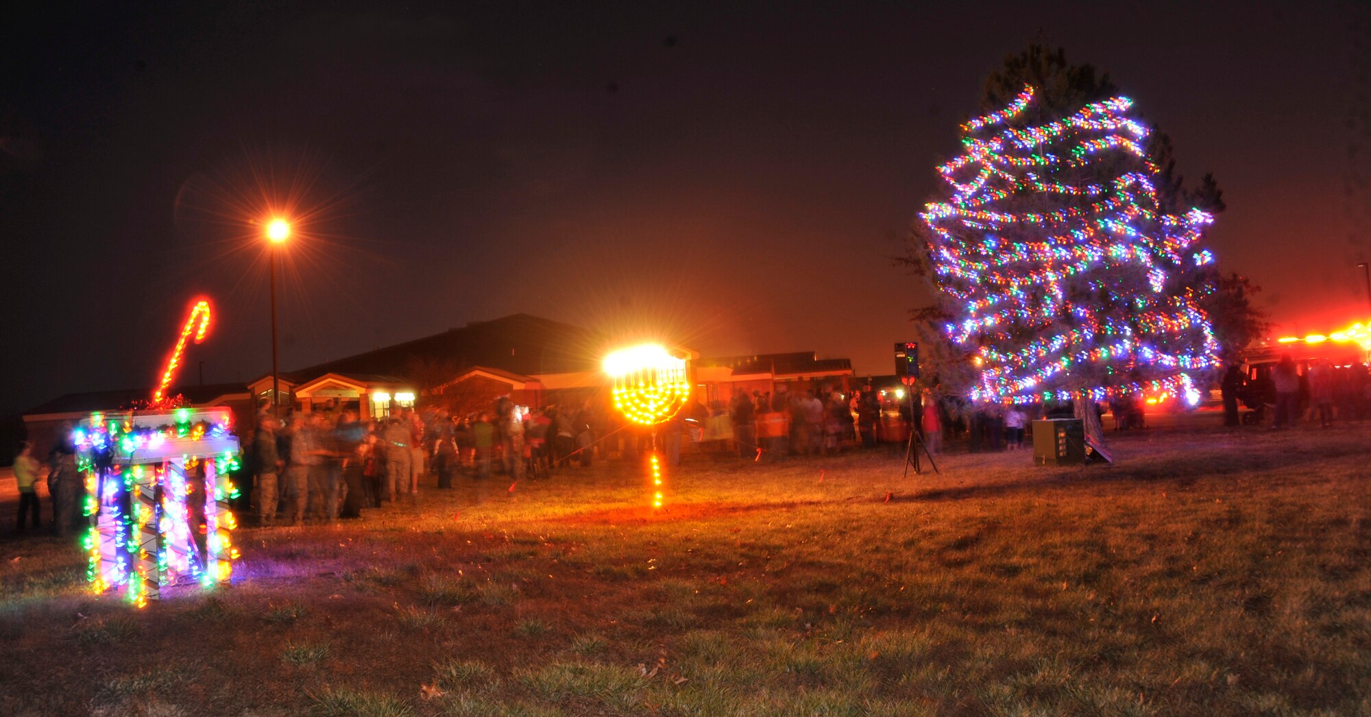 Families, co-workers and friends gather for the tree lighting event at Whiteman Air Force Base, Mo., Dec. 3, 2013. This event included activities such as Santa’s arrival, bingo, ring toss, music and much more. (U.S. Air Force photo by Airman 1st Class Keenan Berry/Released)