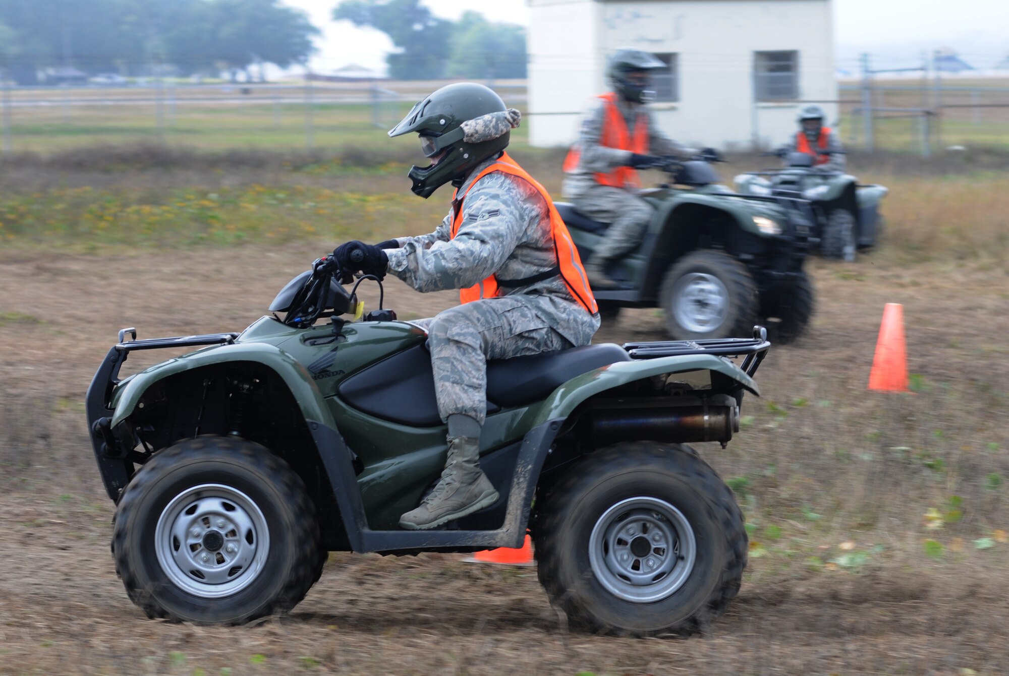 Airman 1st Class Jordan Johnson, 81st Security Forces Squadron, rides through an obstacle course during a basic All Terrain Vehicle Rider Course Dec. 6, 2013, at Keesler Air Force Base, Miss.  The course, presented by the ATV Safety Institute and instructed by Master Sgt. Jeffrey Moody, 81st Wing Staff Agency first sergeant, is designed to give riders the skills necessary to safely operate the vehicles and to react in an emergency situation.  The course began with a safety briefing and a physical inspection on the ATVs.  (U.S. Air Force photo by Kemberly Groue)