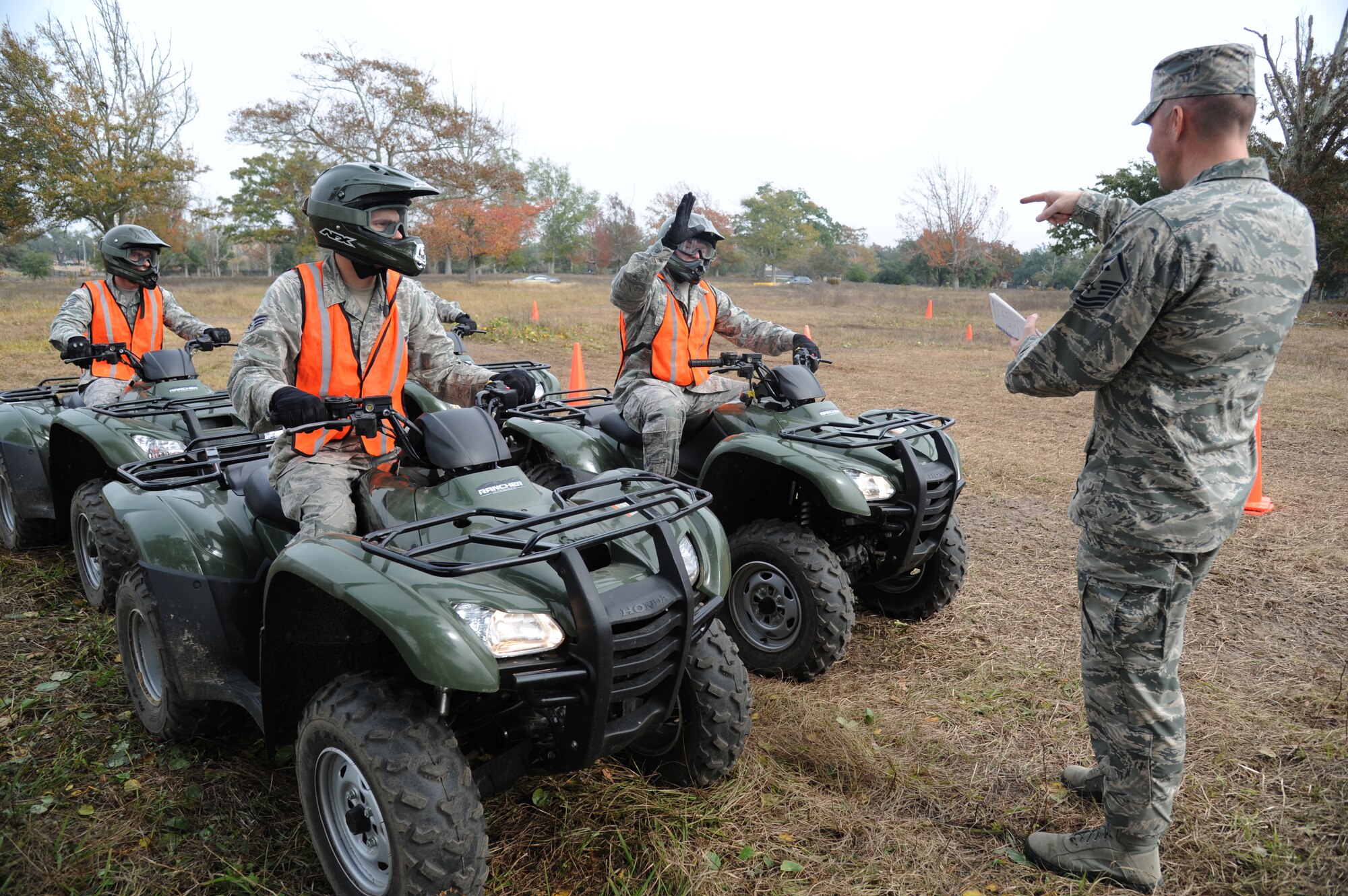Master Sgt. Jeffrey Moody, 81st Wing Staff Agency first sergeant and course instructor, reviews the curriculum for the course with members of the 81st Security Forces Squadron, during a basic All Terrain Vehicle Rider Course Dec. 6, 2013, at Keesler Air Force Base, Miss.  The course, presented by the ATV Safety Institute, is designed to give riders the skills necessary to safely operate the vehicles and to react in an emergency situation.  The course began with a safety briefing and a physical inspection on the ATVs.  (U.S. Air Force photo by Kemberly Groue)