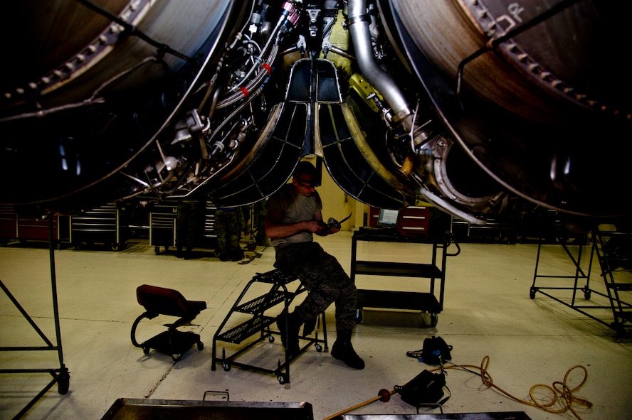 Airman 1st Class Michael Davis, 5th Maintenance Squadron aerospace technician applies safety wire to B-52H Stratofortress engines at Minot Air Force Base, N.D., Dec. 4, 2013. Keeping engines fully capable to carry out any task a pilot may carry out is what the propulsion flight does every day. The Airmen who work on these engines are fully trained and qualified to handle a multitude of procedures. (U.S. Air Force photo/Senior Airman Brittany Y. Auld)