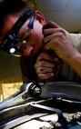 Senior Airman Sean Donnelly, 5th Maintenance Squadron aerospace propulsion technician assembles the aft mount of a B-52H Stratofortress engine at Minot Air Force Base, N.D., Dec. 4, 2013.  Donnelly hails from Stafford, Va.(U.S. Air Force photo/Senior Airman Brittany Y. Auld)