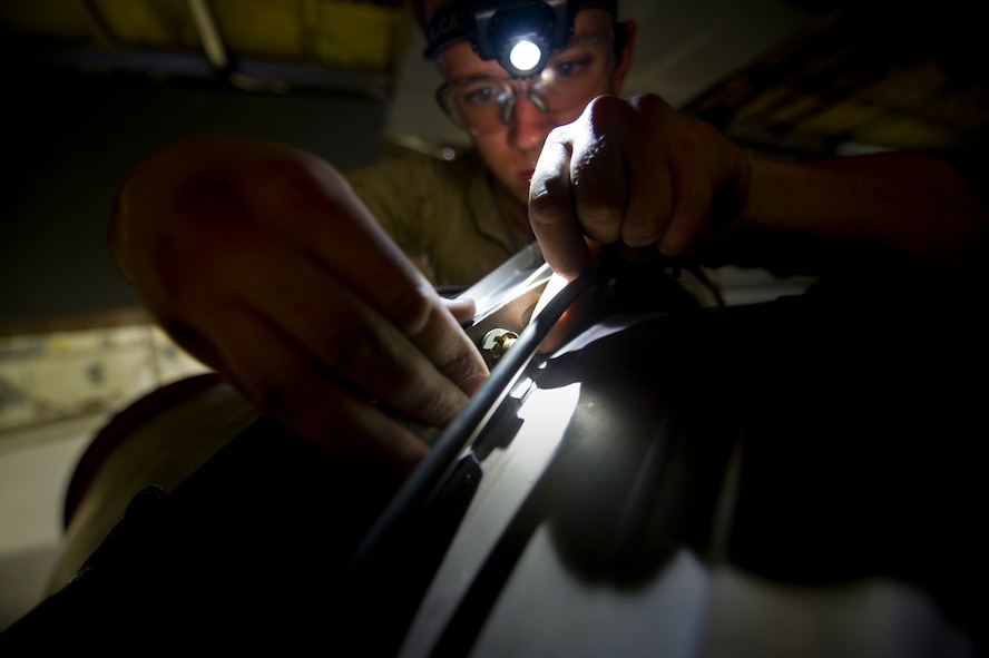 Senior Airman Sean Donnelly, 5th Maintenance Squadron aerospace propulsion technician assembles the aft mount of a B-52H Stratofortress engine at Minot Air Force Base, N.D., Dec. 4, 2013. Keeping engines fully capable to carry out any task a pilot may have is what the propulsion flight does every day. The Airmen who work on these engines are fully trained and qualified to handle a multitude of procedures. (U.S. Air Force photo/Senior Airman Brittany Y. Auld)