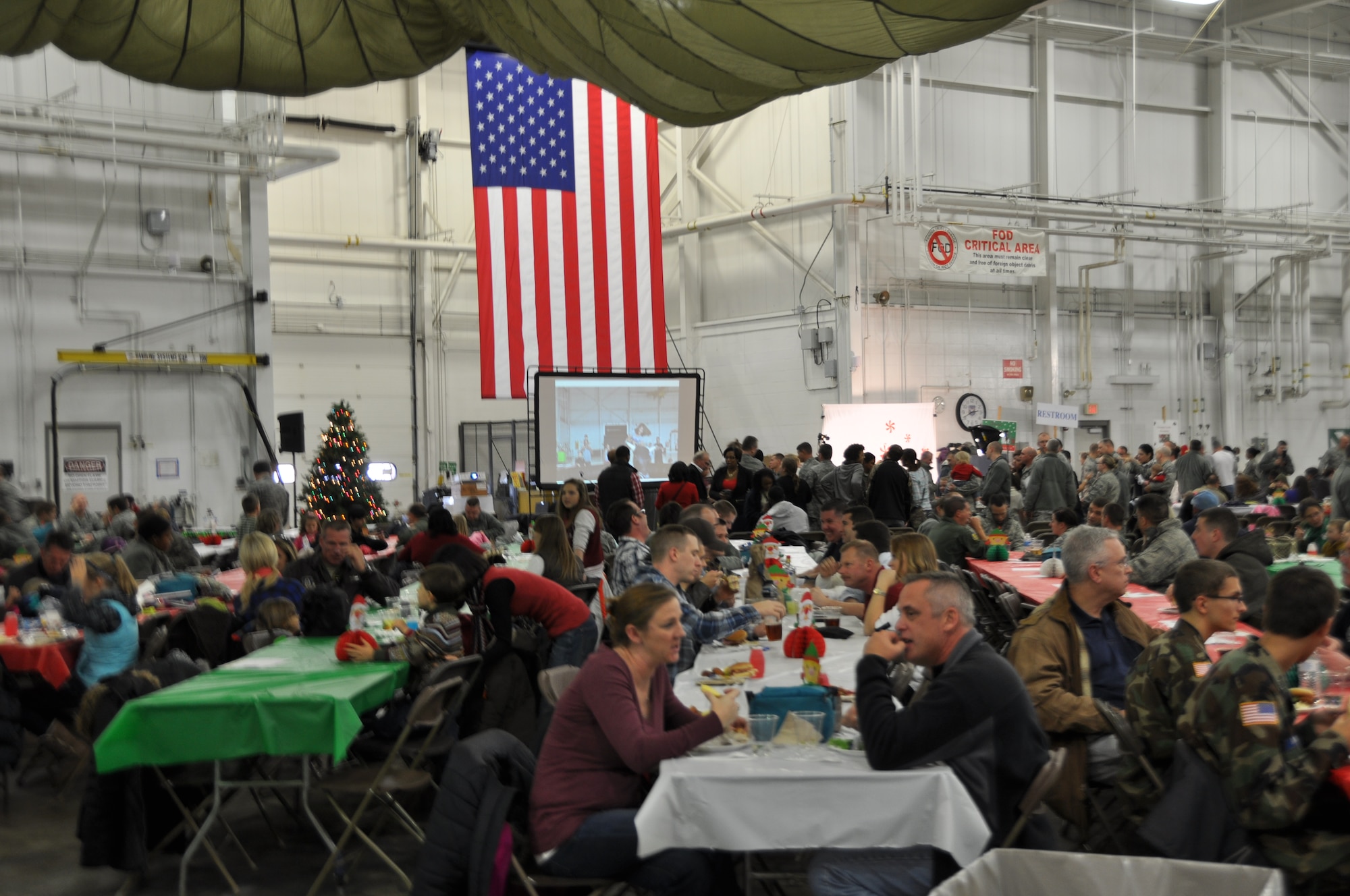 Airmen of the 911th Airlift Wing and their families celebrate the holiday season together during the first ever base-wide holiday party at the Pittsburgh International Air Reserve Station, Dec. 7, 2013. The party, which followed a brief commander’s call, featured food, music, crafts, games for children and even Skype calls with members of the wing who are currently deployed. The party gave Airmen the opportunity to celebrate the time of year with friends and family and to make new memories. (U.S. Air Force photo by Senior Airman Marjorie A. Bowlden