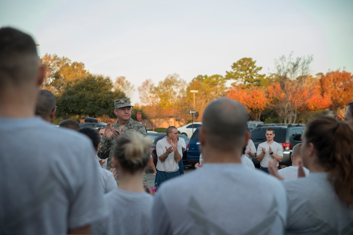 Col. Jeffery DeVore, Joint Base Charleston commander, speaks to JB Charleston Airmen before the Commander’s Challenge 5K Run Dec. 6, 2013, at Joint Base Charleston – Air Base, S.C. The Commander's Challenge is held monthly to test Team Charleston's fitness abilities. (U.S. Air Force photo/ Senior Airman Ashlee Galloway)