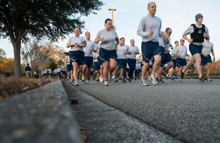 Members of Joint Base Charleston take part in the Commander’s Challenge 5K Run Dec. 6, 2013, at Joint Base Charleston – Air Base, S.C. The Commander's Challenge is held monthly to test Team Charleston's fitness abilities. (U.S. Air Force photo/ Senior Airman Ashlee Galloway)