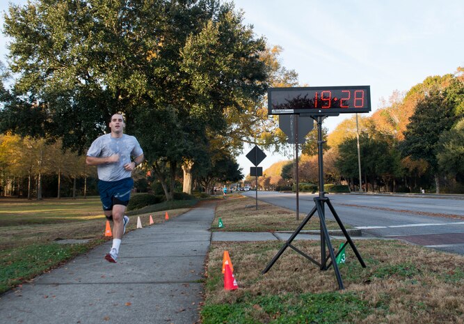 2nd Lt. Phil Ramsey, 628th Civil Engineer Squadron programmer, runs toward the finish line during the Commander’s Challenge 5K Run Dec. 6, 2013, at Joint Base Charleston – Air Base, S.C. The Commander's Challenge is held monthly to test Team Charleston's fitness abilities. Ramsey was the top male runner with a time of 19:28. (U.S. Air Force photo/ Senior Airman Ashlee Galloway)
