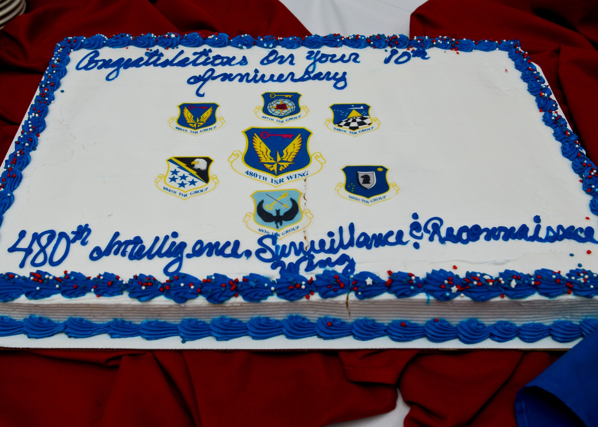 Service members of the 480th Intelligence, Surveillance and Reconnaissance Wing paid tribute to the wing’s history and accomplishments at Langley Air Force Base, Va., Dec. 5, 2013. Since Dec. 1, 2003, the 480th ISR Wing expanded to become the U.S. Air Force leader in globally-networked ISR operations. (U.S. Air Force photo by Airman 1st Class Victoria H. Taylor/Released)