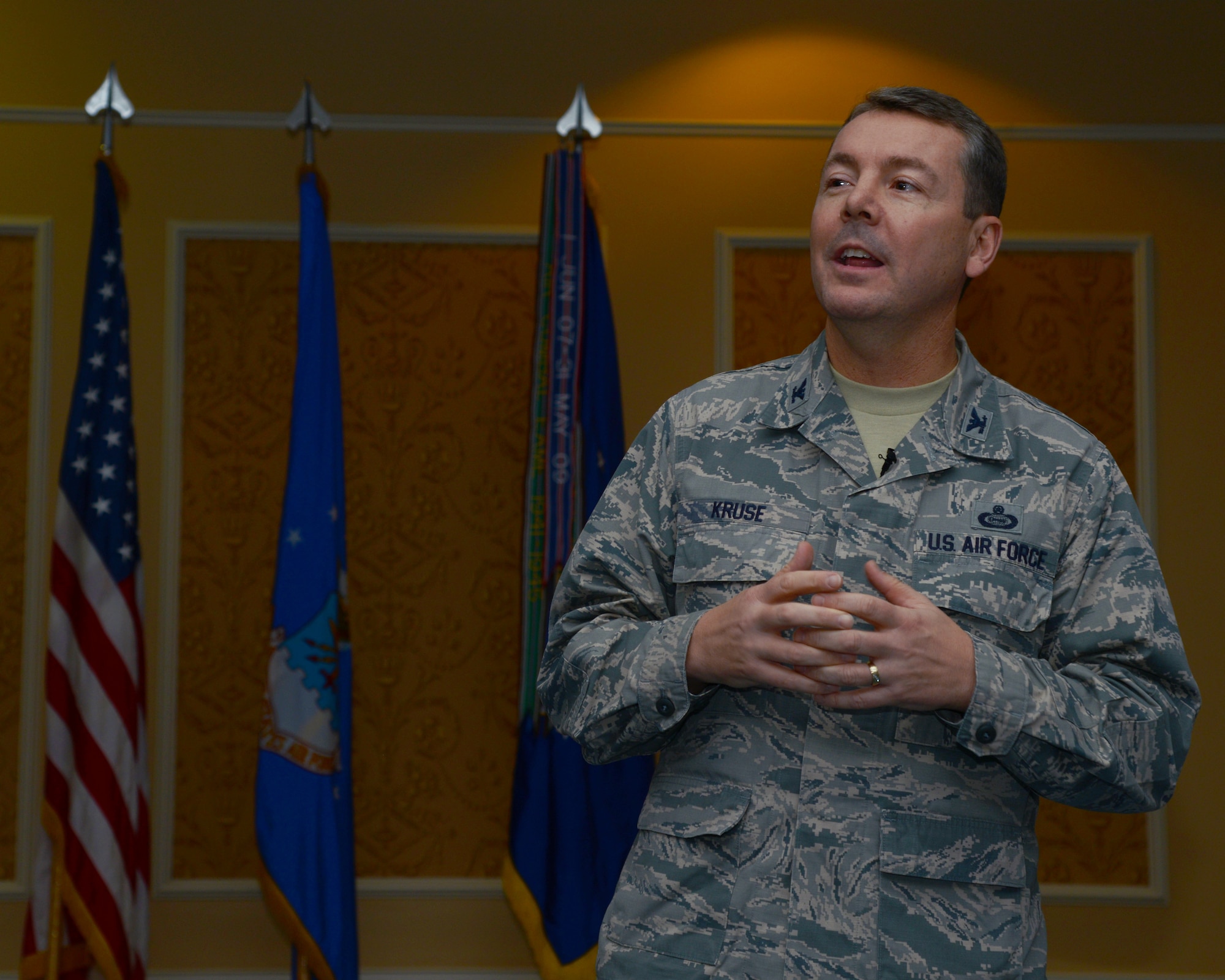U.S. Air Force Col. Jeffrey A. Kruse, 480th Intelligence, Surveillance and Reconnaissance Wing commander, speaks at the Heritage Observance Celebration at Langley Air Force Base, Va., Dec. 5, 2013. Three ISR Airmen also gave presentations which focused on their experience in a deployed environment that directly affected the mission on home soil. (U.S. Air Force photo by Airman 1st Class Victoria H. Taylor/Released)