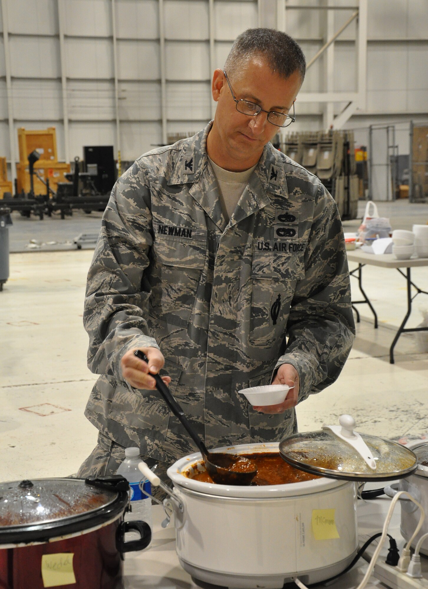 WRIGHT-PATTERSON AIR FORCE BASE, Ohio – Col. Brett Newman, 445th Maintenance Group commander, prepares to sample some chili while serving as a judge for the 445th Airlift Wing Chili Cook-off. The event raised $391 for the Combined Federal Campaign. (U.S. Air Force photo/Stacy Vaughn)