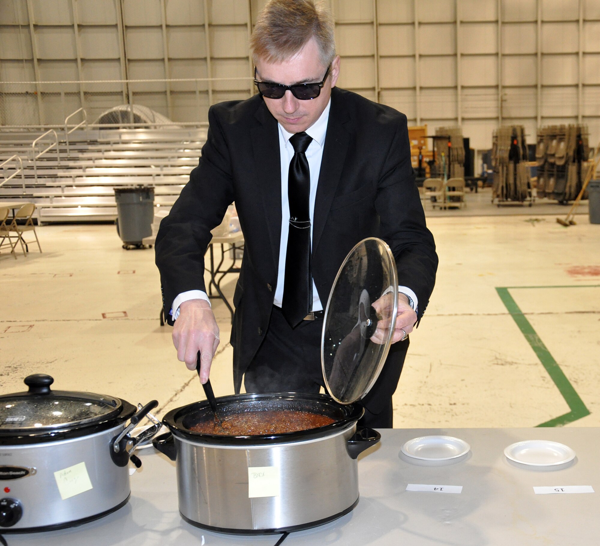 WRIGHT-PATTERSON AIR FORCE BASE, Ohio – Master Sgt. Timothy Back, 445th Force Support Squadron, cyber systems operations craftsman, stirs his chili in preparation for the judging during the wing’s annual chili cook-off Oct. 31.  The event, featuring 19 pots of various types of chili, raised $391 for the Combined Federal Campaign. (U.S. Air Force photo/Stacy Vaughn)