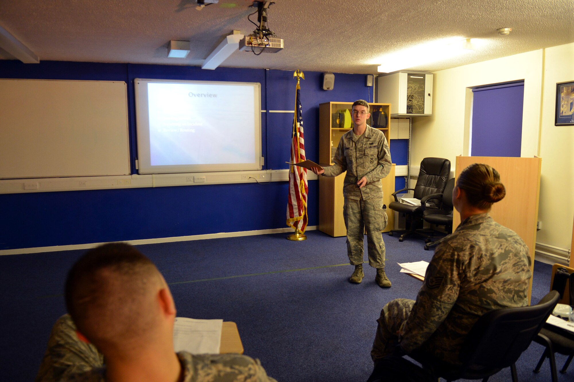 U.S. Air Force Senior Airman Nikolaus Schmidt, 100th Security Forces Squadron reports and analysis clerk from Spring Valley, Minn., teaches a Security Forces Management Information System class Nov. 20, 2013, to Team Mildenhall members  on RAF Mildenhall, England. Schmidt was selected for spotlight for exhibiting the Air Force Core Value of Excellence in All We Do. (U.S. Air Force photo by Airman 1st Class Kyla Gifford/Released) 