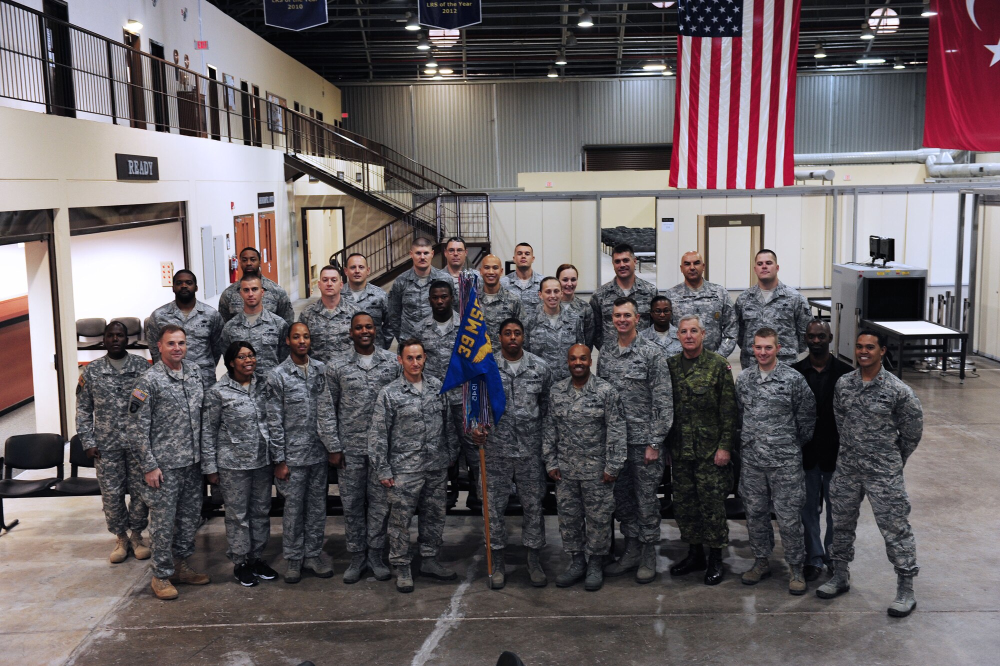 U.S. Army Lt. Gen. Frederick "Ben” Hodges, commander of NATO’s Allied Land Command, and Canadian Army Chief Warrant Officer Mark Saulnier, command sergeant major of Allied Force Command Heidelberg, pose with Airmen from the 39th Logistics Readiness Squadron for a group photo Dec. 9, 2013, at Incirlik Air Base, Turkey. While visiting the 39th LRS, Hodges gave a coin to Airman 1st Class Erika Van Domelen, 39th LRS logistics planner, for her hard work towards the mission. (U.S. Air Force photo by Airman 1st Class Nicole Sikorski/Released) 