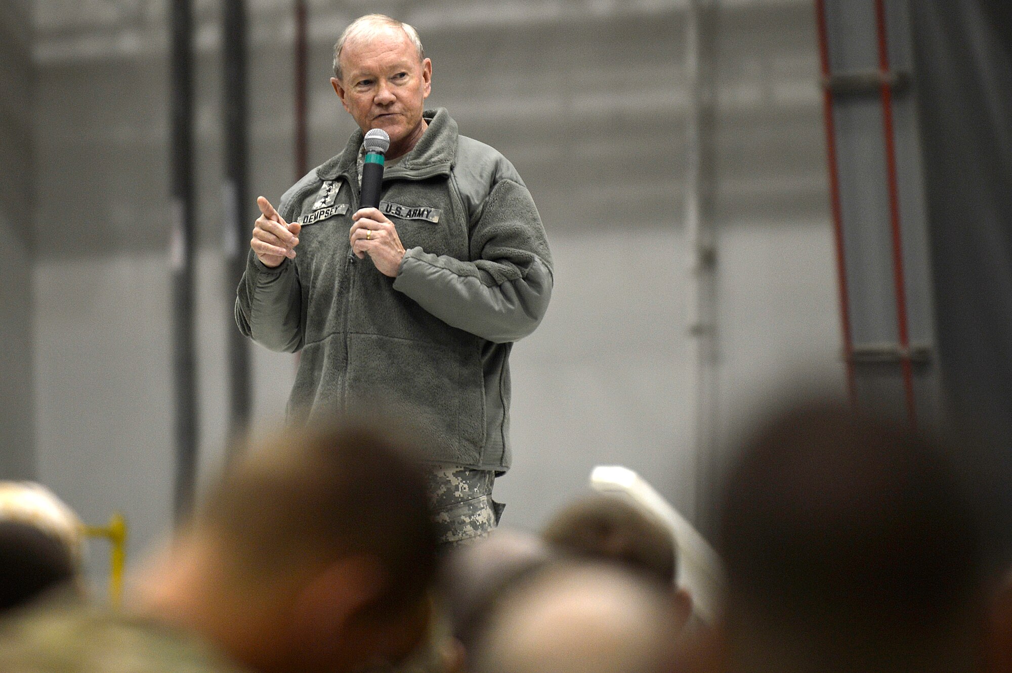 U.S. Army Gen. Martin E. Dempsey, Chairman Joint Chiefs of Staff, addresses service members during a United Service Organization Holiday Troop Visit at Bagram Airfield, Afghanistan, Dec. 9, 2013. Dempsey serves as the principal military advisor to the president, the secretary of defense and the National Security Council. (U.S. Air Force photo/Senior Airman Kayla Newman) 