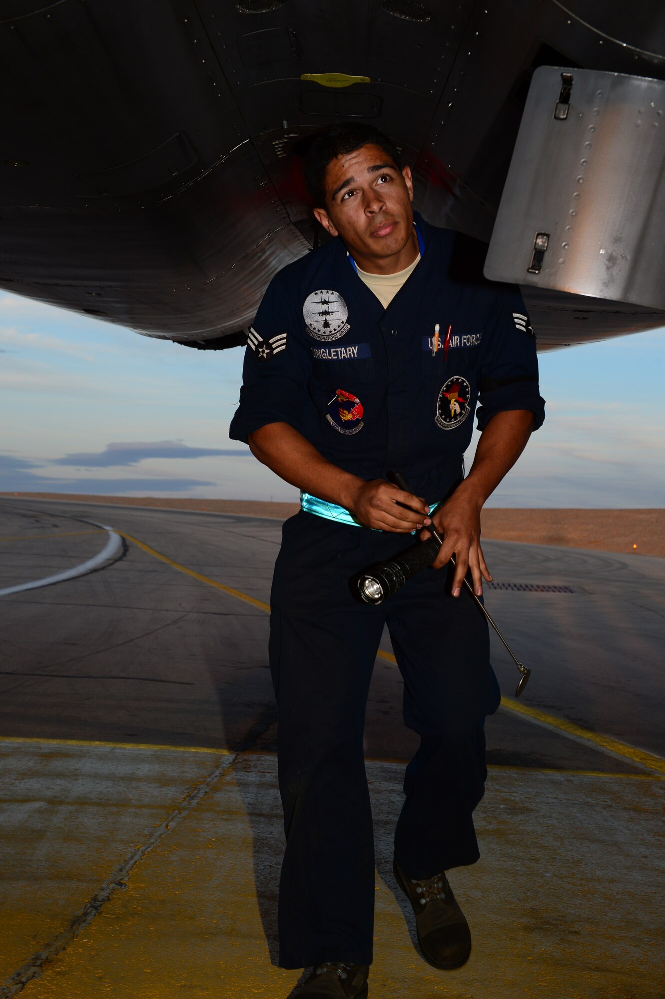 Senior Airman Dominique Singletary, 48th Aircraft Maintenance Squadron assistant dedicated crew chief, performs routine aircraft maintenance at Uvda Air Force Base, Israel, Nov. 24, 2013. Singletary was nominated for a Liberty Spotlight because he displays the core value of “Excellence in All We Do.” (U.S. Air Force photo by Master Sgt. Lee Osberry/Released)  