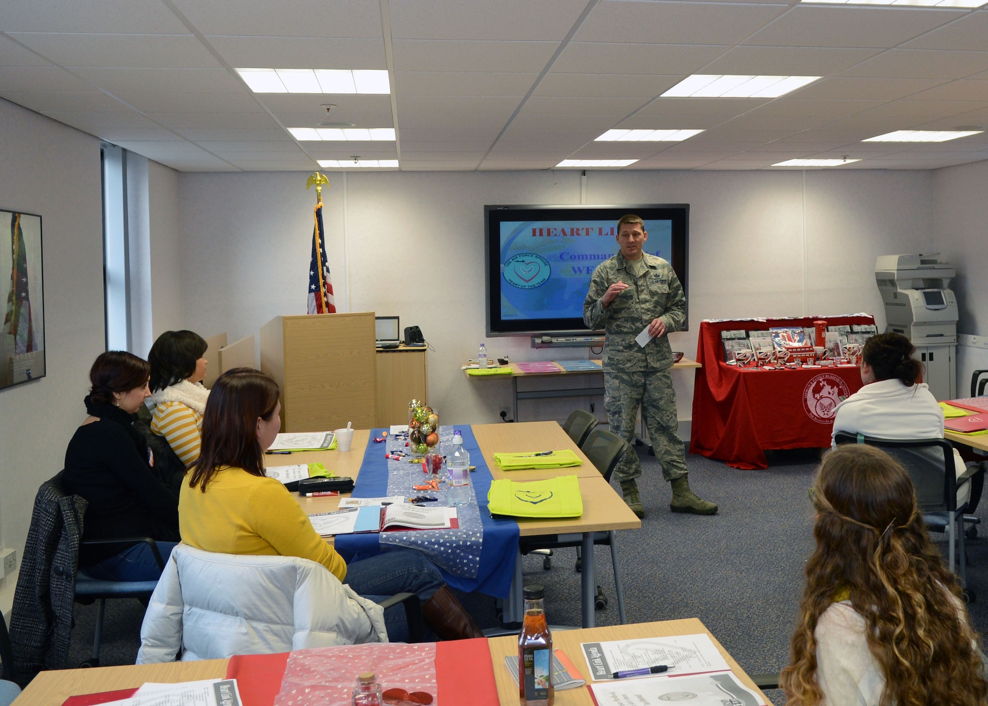 U.S. Air Force Chief Master Sgt. Tracy Jones, 100th Air Refueling Wing command chief, talks to Team Mildenhall spouses during the Heart Link program Dec. 6, 2013, at the Airman and Family Readiness Center on RAF Mildenhall, England. Jones talked to spouses about their importance in the military. (U.S. Air Force photo by Airman 1st Class Jonathan Light/Released)