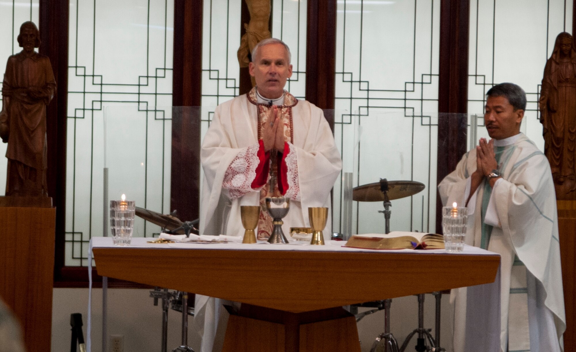 Bishop F. Richard Spencer, Auxiliary Bishop Archdiocese for the Military Services, USA, (left) and Chaplain (Capt.) Mario Rosario celebrate Mass during the Bishops visit to Kunsan Air Base, Republic of Korea, Dec. 9, 2013.  Bishop Spencer serves as the Vicar for all military Chapels and U.S. State Department Embassies in Europe and Asia of the Archdiocese for the Military Services and is responsible for all the Catholics deployed or assigned in those parts of the world.  (U.S. Air Force photo by Tech. Sergeant Alex Griffin/Released)
