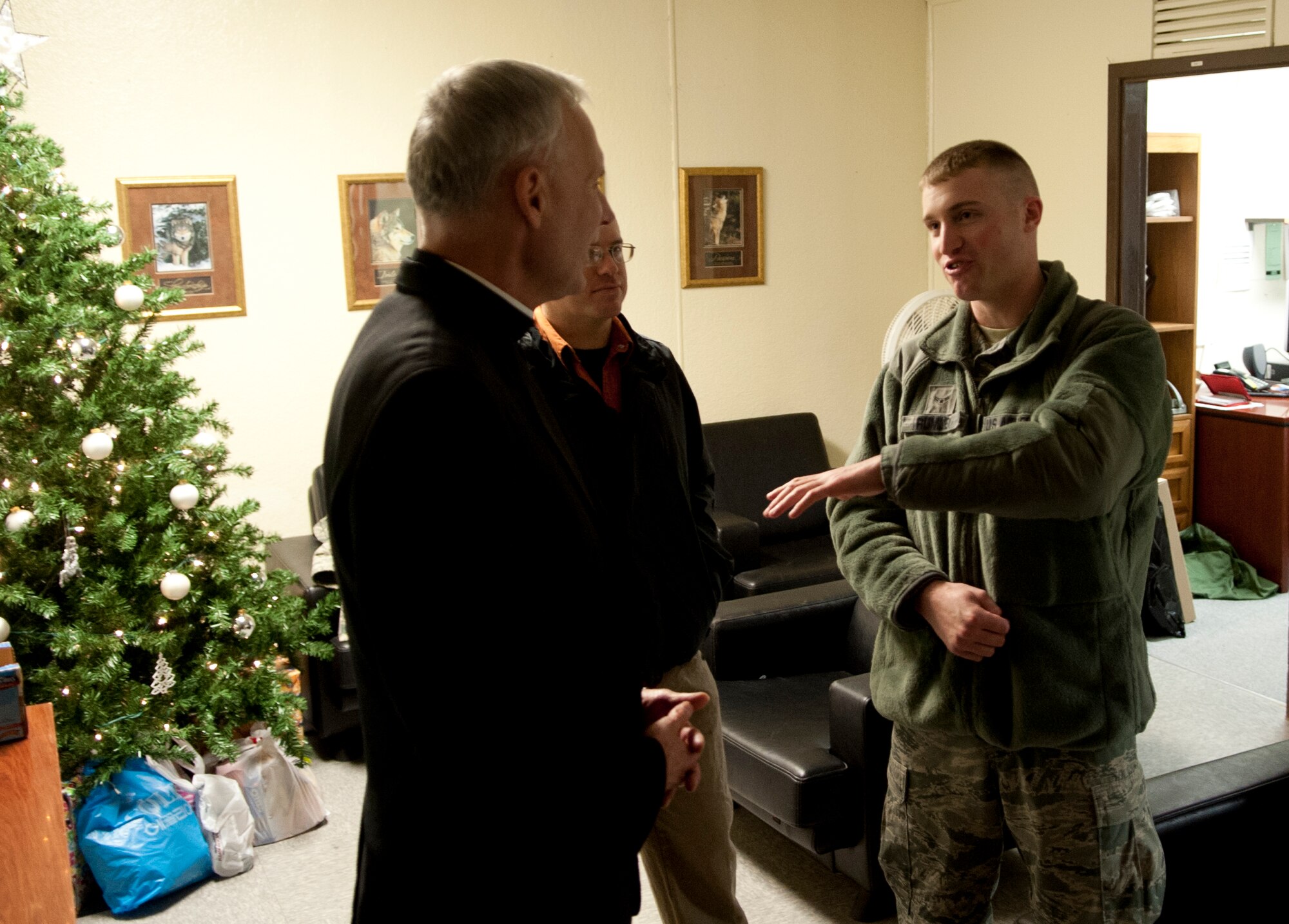 Bishop F. Richard Spencer, Auxiliary Bishop Archdiocese for the Military Services, USA, (left) listens to Airman First Class Spencer Rumley, 8th Security Forces Squadron Security Systems Maintainer, during a visit to Kunsan Air Base, Republic of Korea, Dec. 9, 2013.  Bishop Spencer serves as the Vicar for all military Chapels and U.S. State Department Embassies in Europe and Asia of the Archdiocese for the Military Services and is responsible for all the Catholics deployed or assigned in those parts of the world.  (U.S. Air Force photo by Tech. Sergeant Alex Griffin/Released)