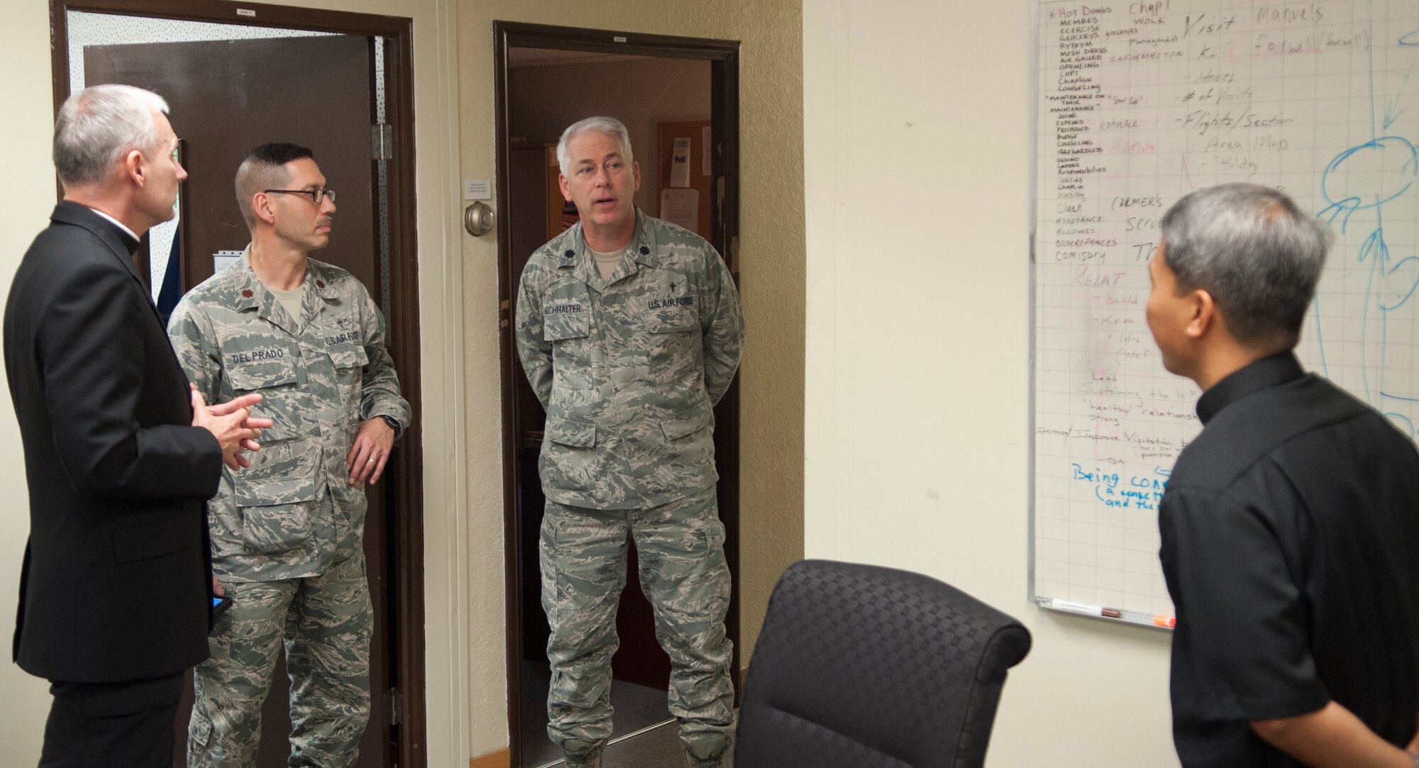 Bishop F. Richard Spencer, Auxiliary Bishop Archdiocese for the Military Services, USA, left, listens to Chaplain (Lt. Col.) Bryan Hochhalter, center, 8th Fighter Wing Chaplain during a visit to Kunsan Air Base, Republic of Korea, Dec. 9, 2013.  Bishop Spencer serves as the Vicar for all military Chapels and U.S. State Department Embassies in Europe and Asia of the Archdiocese for the Military Services and is responsible for all the Catholics in those areas.  (U.S. Air Force photo by Tech. Sergeant Alex Griffin/Released) 