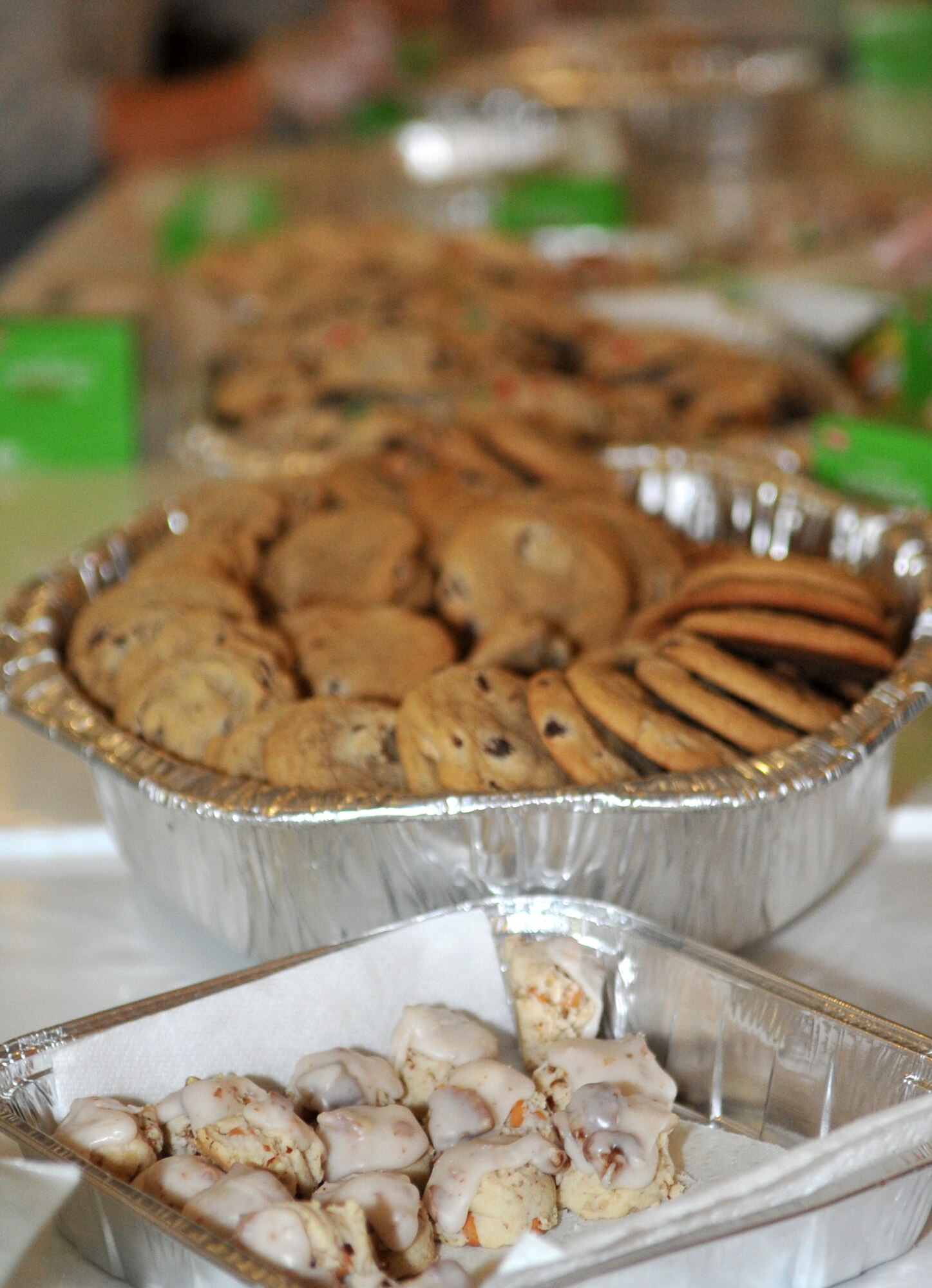 Several varieties of cookies and other sugary confections are lined up to be included in goodie bags for Operation Sweet Treat in the Officers’ Club at Osan Air Base, Republic of Korea, Dec. 7, 2013. The base commissary donated complete cookie-baking kits earlier this month in support of OST, which volunteers used to bake more than 39,000 cookies. (U.S. Air Force photo/Airman 1st Class Ashley J. Thum)