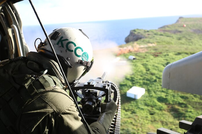 Petty Officer 2nd Class Jeremy A. Cieplich fires a GAU-21/A .50 caliber machine gun mounted in an MH-60S Seahawk helicopter at simulated enemy personnel during live-fire, close-air support training Dec. 10 at Farallon de Medinilla Target Range, Northern Mariana Islands. The MH-60Ss are currently forward deployed to the island of Tinian, coordinating with Marine Corps units during Exercise Forager Fury II. FF II is an aviation training relocation event intended to meet U.S.-Japan bilateral goals such as reduced local impacts by dispersing the training to other areas and increased operational readiness. Cieplich is a naval aircrewman with Helicopter Sea Attack Squadron 25 based out of Andersen Air Force Base, Guam.