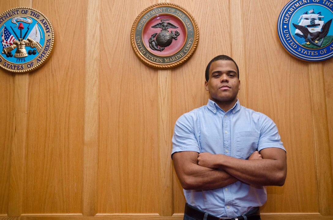 Jorge Estevez, stands inside Cpl. Jennifer M. Parcell Ceremony Room at the Military Entrance Processing Station aboard Fort George G. Meade, Md., Dec. 2, 2013. Estevez, a native of the Dominican Republic, lost 140 pounds in order to join the Marine Corps. He is currently attending recruit training at Marine Corps Recruit Depot Parris Island, S.C. (U.S. Marine Corps photo by Cpl. Bryan Nygaard/Released)