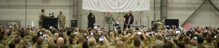 Chairman of the Joint Chiefs of Staff Gen Martin E. Dempsey and USO entertainers host Soldiers, Sailors, Marines and DOD civilians to a holiday and USO show in Bagram, Afghanistan on Dec 9, 2013. The USO Holiday Tour brought a variety of celebrities on board, including reality television stars Willie and Jep Robertson from "Duck Dynasty," Washington Nationals first-baseman Adam LaRoche, comedian Nephew Tommy, pop singer Bridget Kelly, and actress Allison Haislip. DOD Photo by D. Myles Cullen Digital