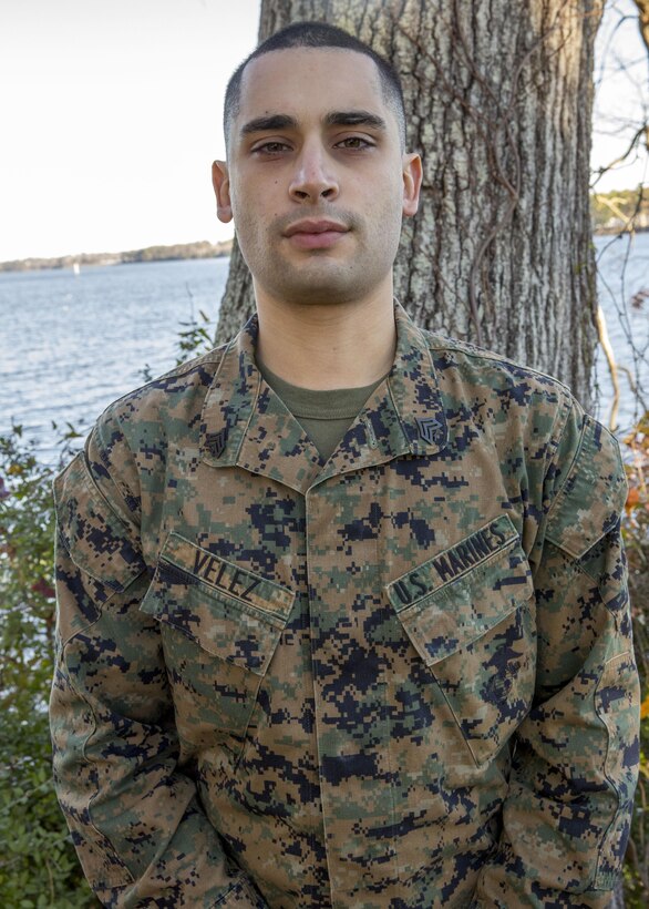 Sgt. Xavier Velez, a data systems specialist with the 26th Marine Expeditionary Unit (MEU), and Terryville, Conn., native, poses for a photo outside of the MEU's command post aboard Marine Corps Base Camp Lejeune, N.C., Dec. 11, 2013. Velez deployed for eight-months with the MEU in the Fifth and Sixth Fleet areas of operation. He was awarded the Navy and Marine Corps Achievement Medal for his accomplishments and contributions to mission success throughout the duration of the deployment.