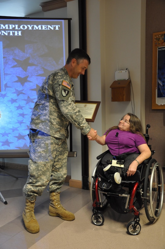 Walla Walla District Commander Lt. Col. Drew Kelly thanks Purchasing Agent Ruth Johnson for her presentation during a National Disability Employment Awareness Month observance.