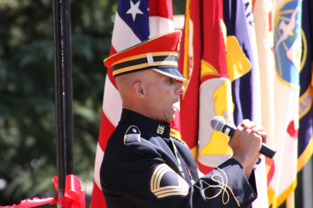 Master Sgt. Antonio Giuliano, U.S. Army Band vocalist, provides a stirring a cappella rendition of the Star Spangled Banner at the Sept. 18 Old Post Chapel ribbon cutting ceremony at Fort Myer, Va. 