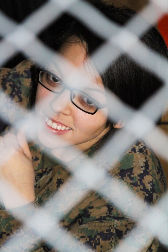 U.S. Marine Corps Sgt. Donna Williams took some time out to show off her warehouse. As the Recruiting Station Frederick’s logistics clerk, she is responsible for the security of “The Cage” where RS Frederick keeps all of its valuable gear.  She was selected as the 4th Marine Corps District’s Marine of the Year. (U.S. Marine Corps photo by Sgt. Amber Williams/Released)